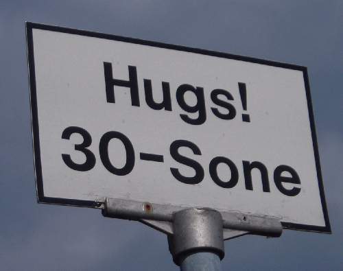 hugs road sign